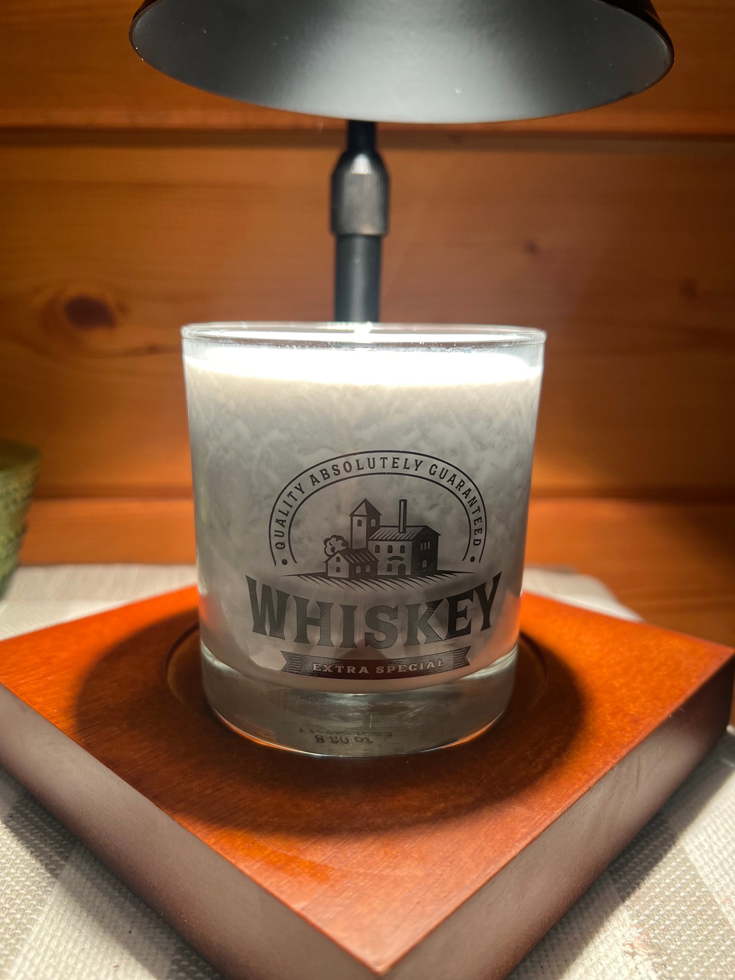 Mahogany teakwood in whiskey glass with wick